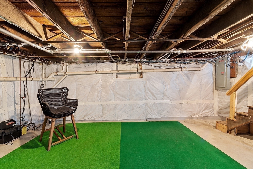 3 Baker Road Nahant, MA 01908 - Photo 33 of 41 a view of a backyard with table and chairs with wooden floor