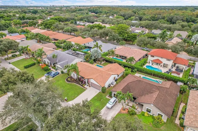 an aerial view of residential houses with outdoor space