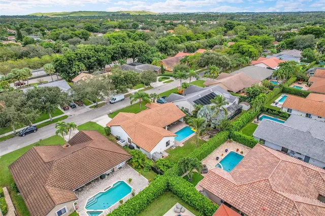 an aerial view of a house with a garden