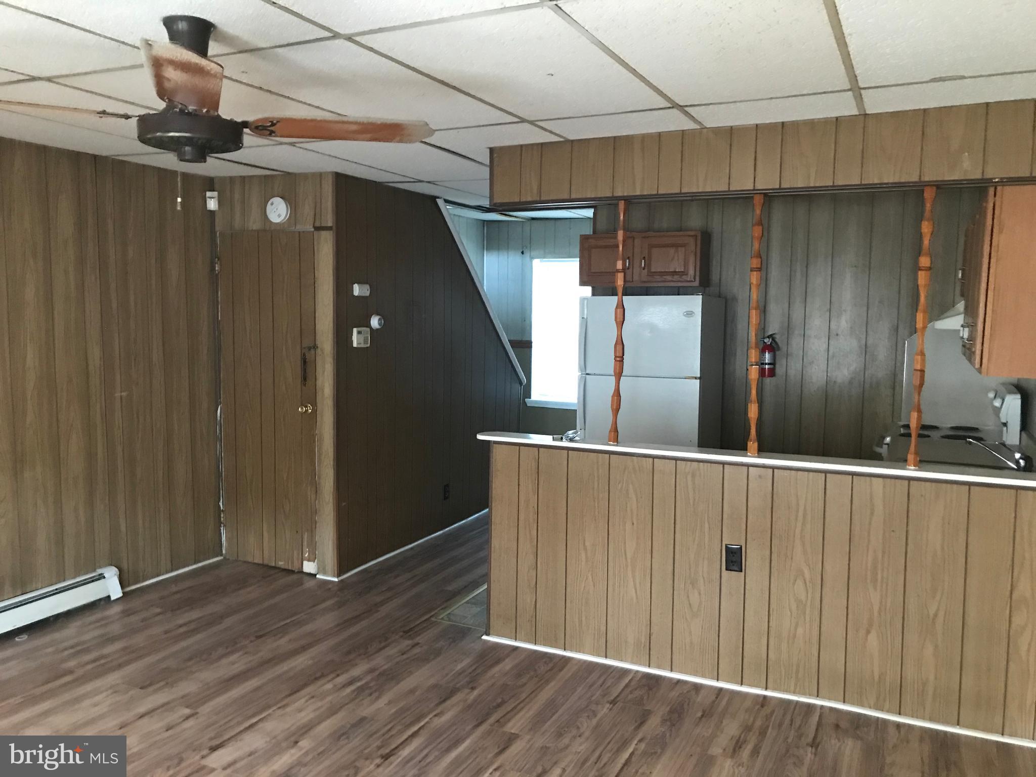 27 Upland Avenue Brookhaven, PA 19015 - Photo 4 of 8 a view of a hallway with wooden floor