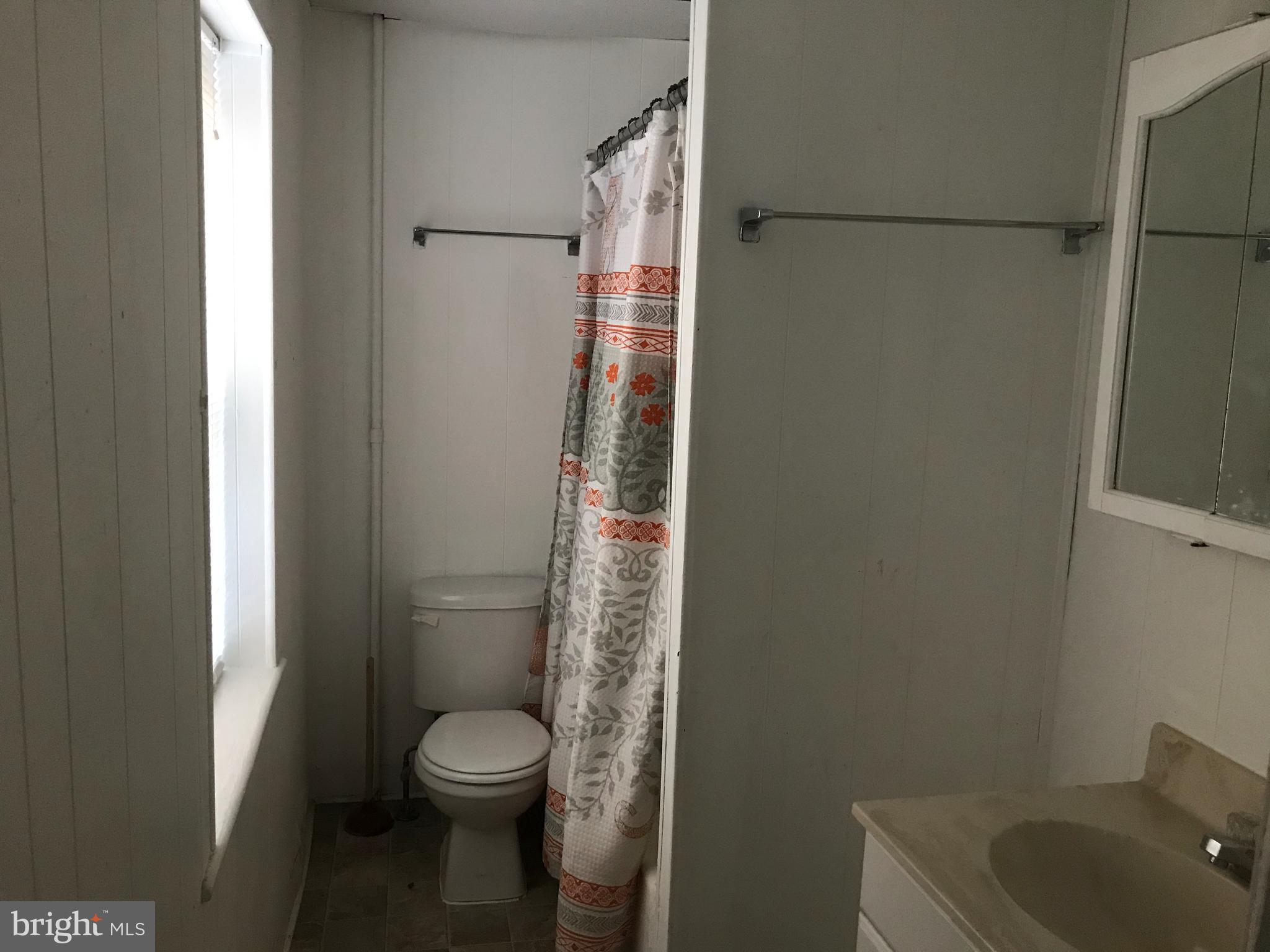 27 Upland Avenue Brookhaven, PA 19015 - Photo 5 of 8 a bathroom with a toilet and a shower