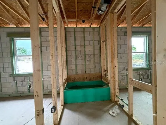 a view of empty room with windows