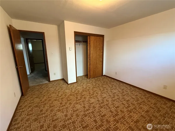 an empty room with a bench