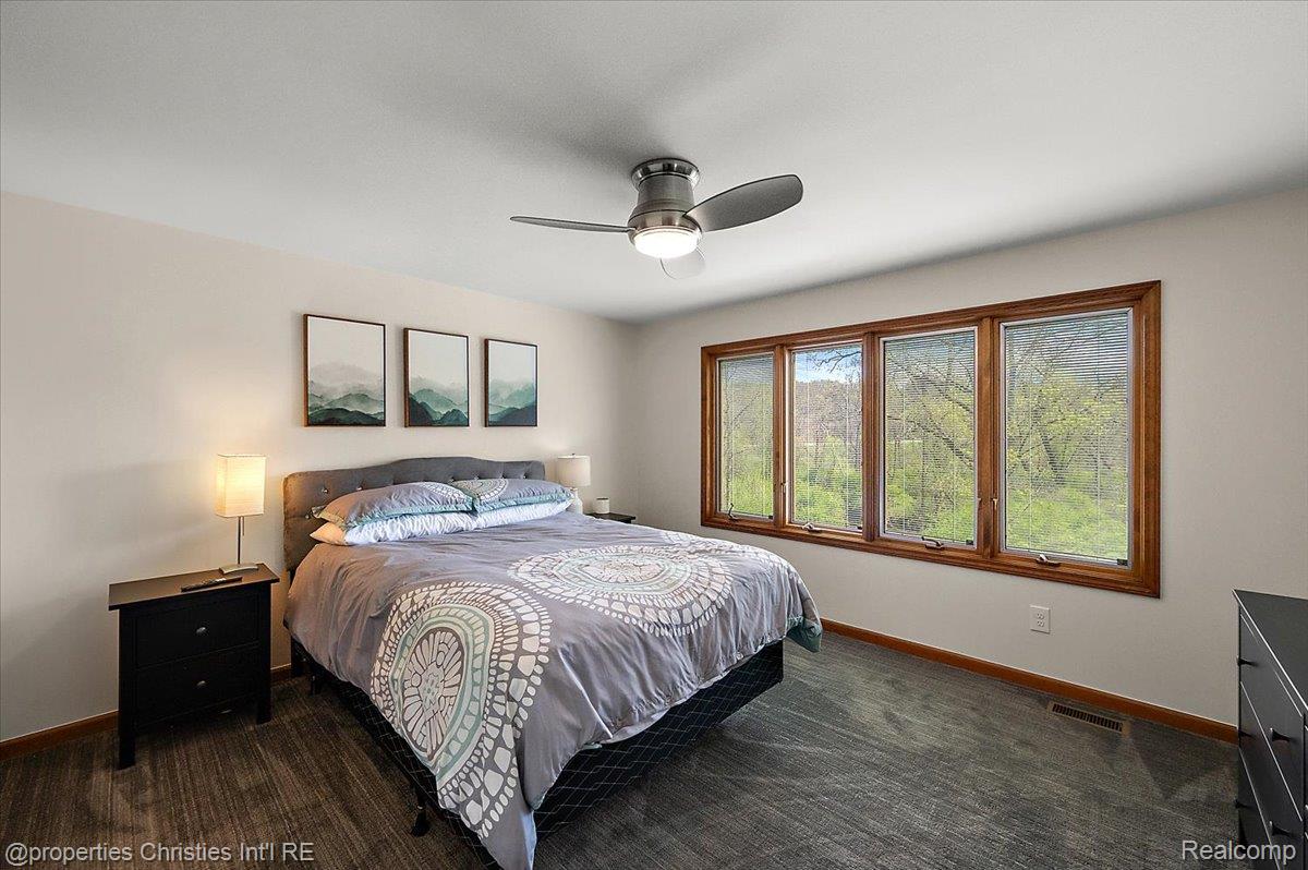 1071 Woodbridge Lane Rochester, MI 48306 - Photo 44 of 76 Bedroom with dark colored carpet and ceiling fan