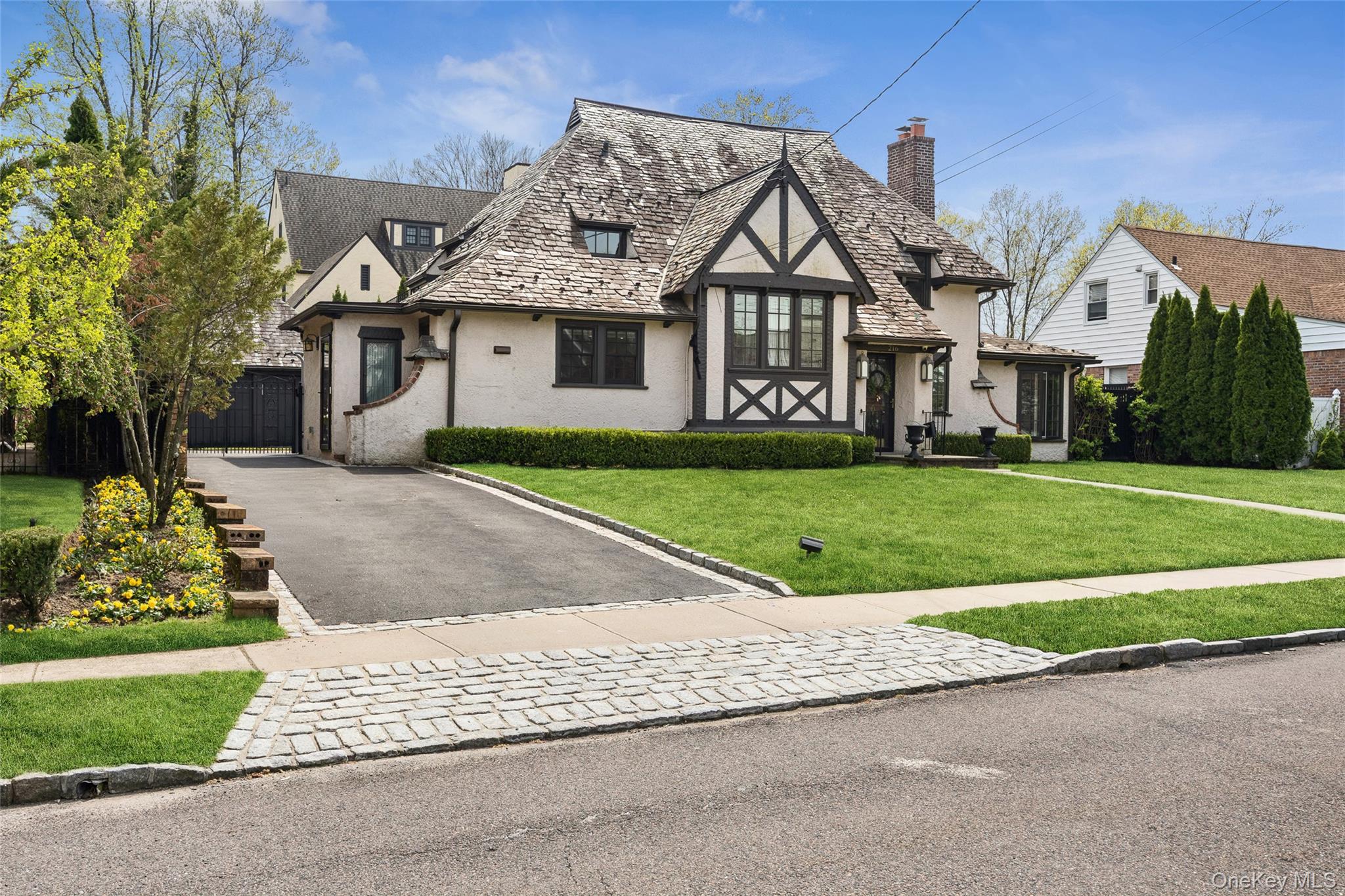 216 Beverly Road Queens, NY 11363 - Photo 28 of 50 a front view of a house with a yard