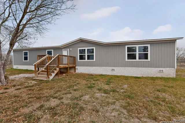 a house view with a backyard space