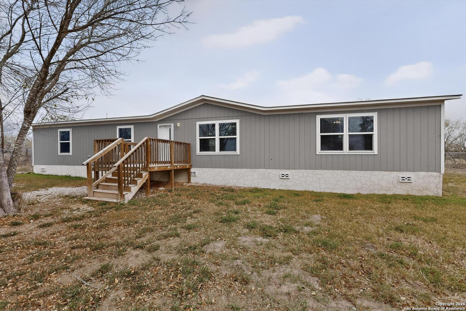 19124 La Gloria Road Elmendorf, TX 78112 - Photo 2 of 45 a house view with a backyard space