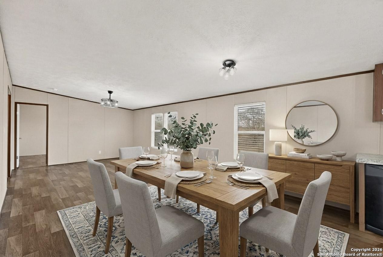 19124 La Gloria Road Elmendorf, TX 78112 - Photo 7 of 45 a view of a dining room with furniture