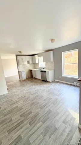 a view of a kitchen with a sink and a stove