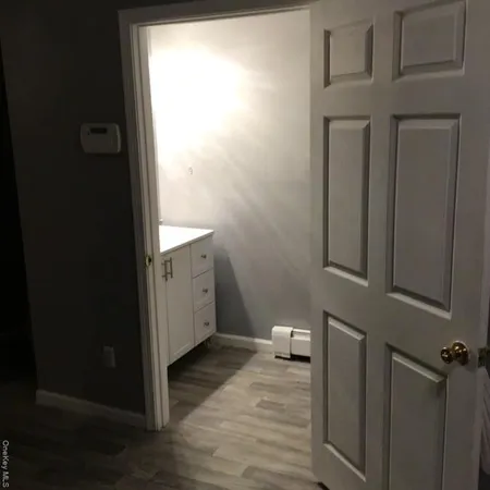 a white toilet sitting next to a bathroom sink