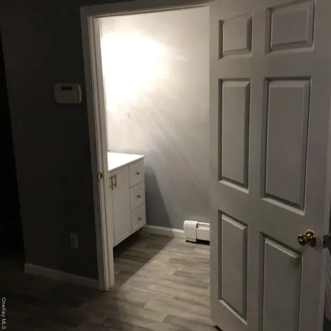 a white toilet sitting next to a bathroom sink