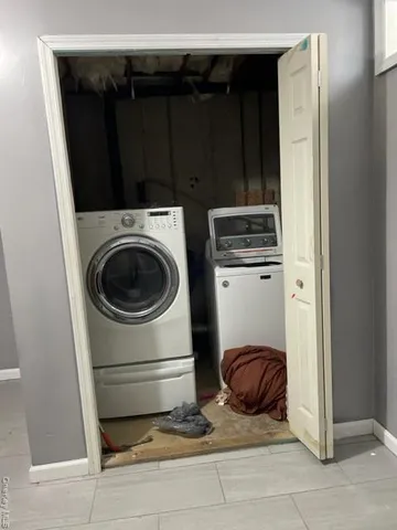 a view of a room with an empty space and a window