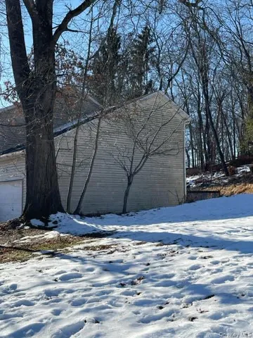 a view of tree in front of a house