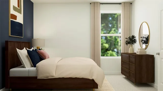 a bedroom with a bed and window