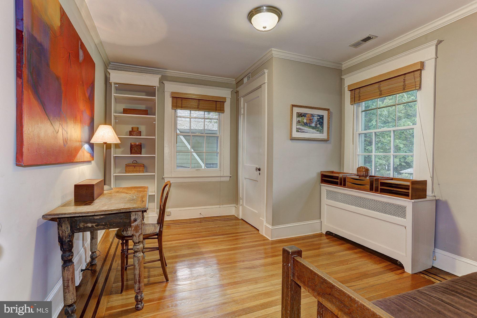 214 Midhurst Road Baltimore, MD 21212 - Photo 22 of 30 a view of a room with furniture and wooden floor
