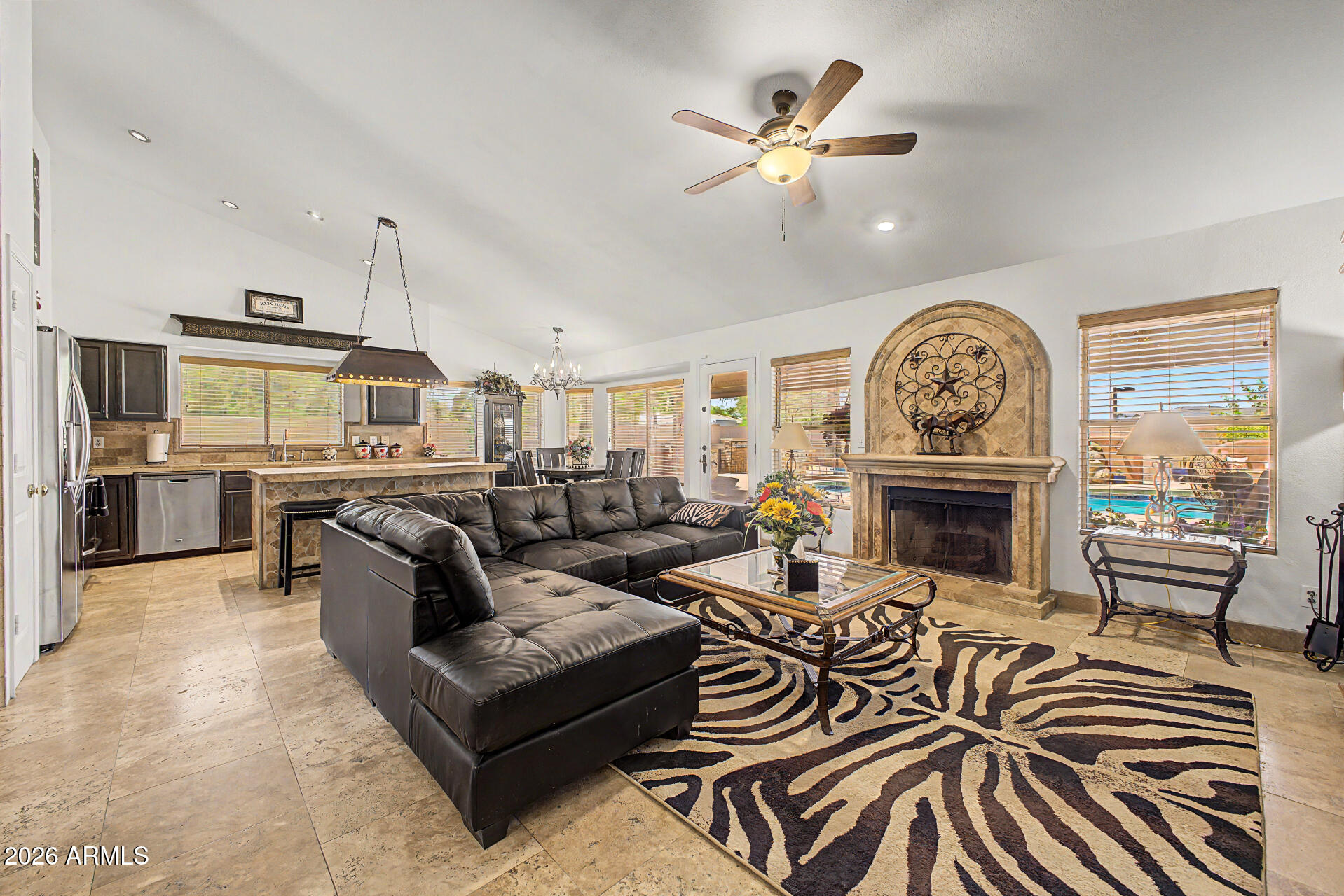3948 North Ranier Mesa, AZ 85215 - Photo 15 of 69 a living room with furniture a fireplace and a flat screen tv