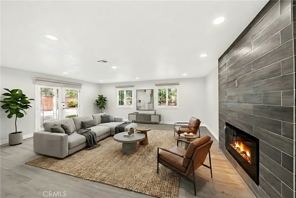 19361 Plummer Street Northridge, CA 91324 - Photo 18 of 42 a living room with furniture and a fireplace
