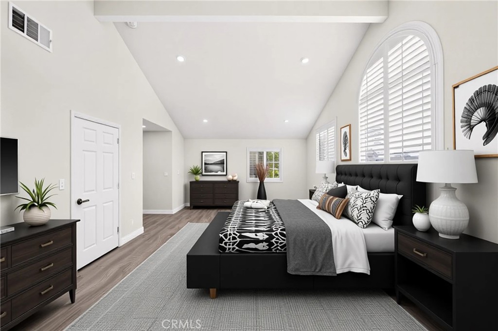 19361 Plummer Street Northridge, CA 91324 - Photo 20 of 42 a bedroom with a bed and a potted plant