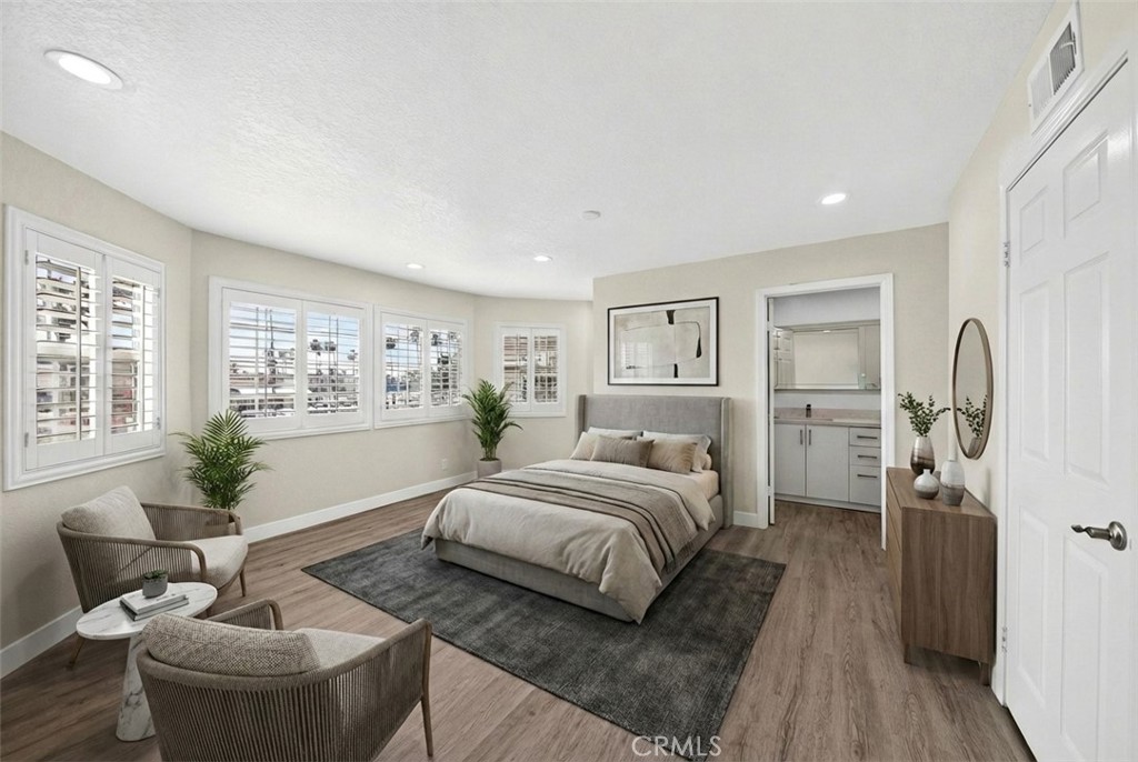 19361 Plummer Street Northridge, CA 91324 - Photo 21 of 42 a bedroom with a bed and a couch