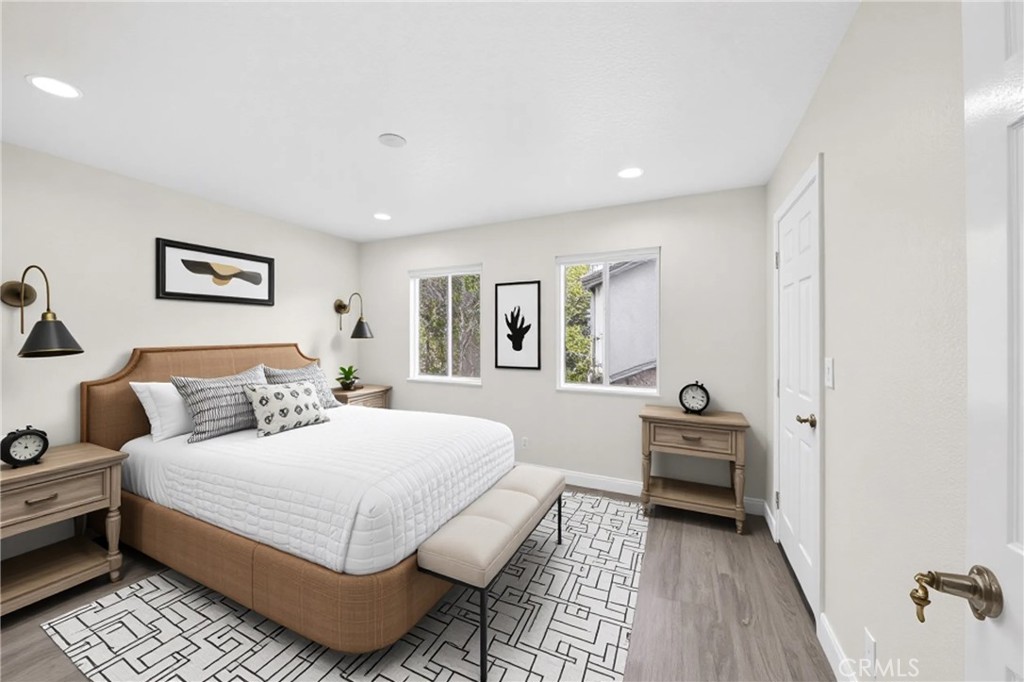 19361 Plummer Street Northridge, CA 91324 - Photo 22 of 42 a bedroom with a large bed and a couch