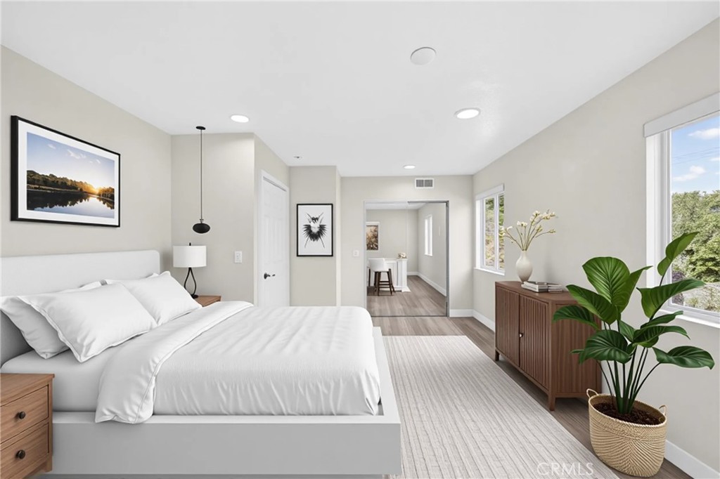 19361 Plummer Street Northridge, CA 91324 - Photo 23 of 42 a bedroom with furniture and a potted plant