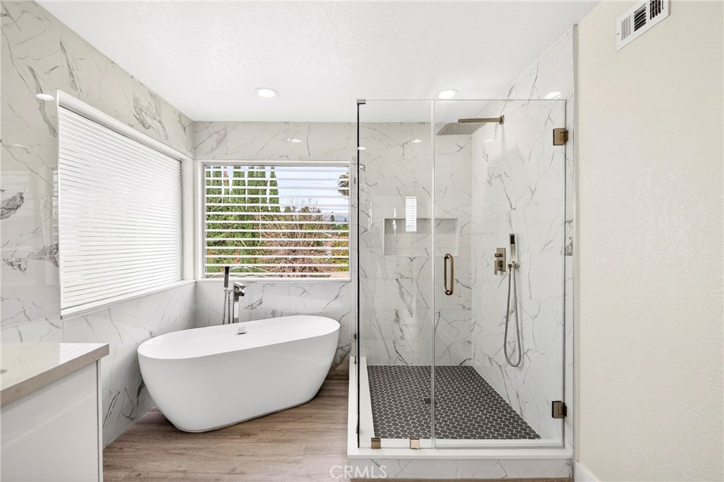 19361 Plummer Street Northridge, CA 91324 - Photo 34 of 42 a bathroom with a bathtub and shower