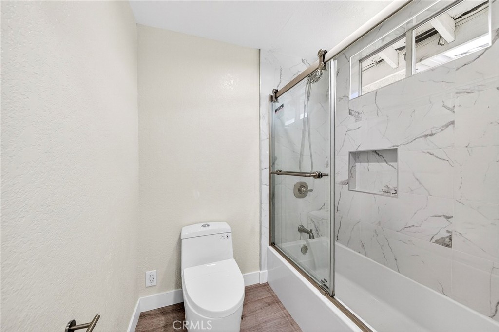 19361 Plummer Street Northridge, CA 91324 - Photo 41 of 42 a bathroom with a toilet and a shower