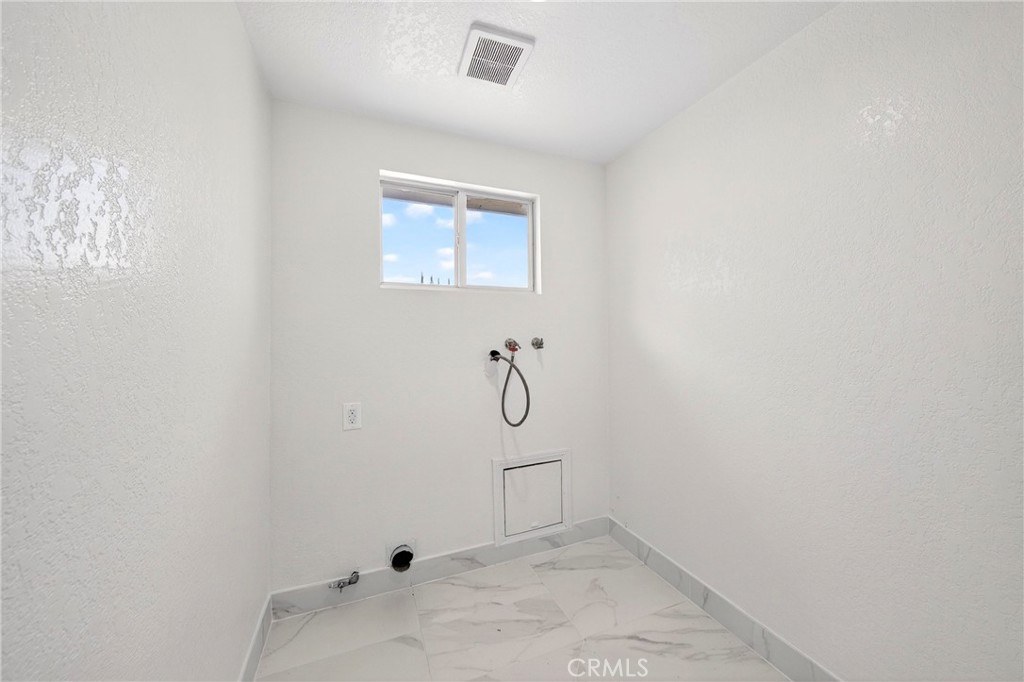 19361 Plummer Street Northridge, CA 91324 - Photo 42 of 42 a bathroom with a glass shower door