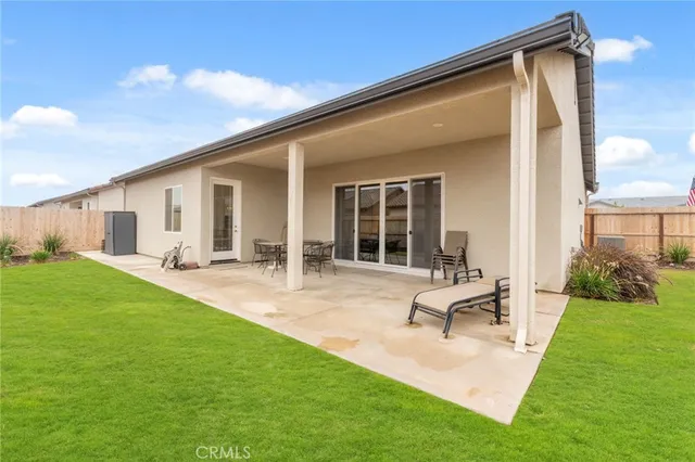 a backyard of a house with seating space