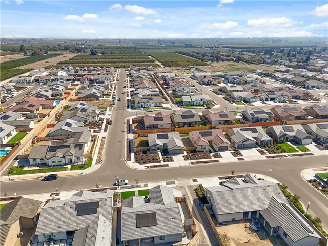 an aerial view of residential building and lake