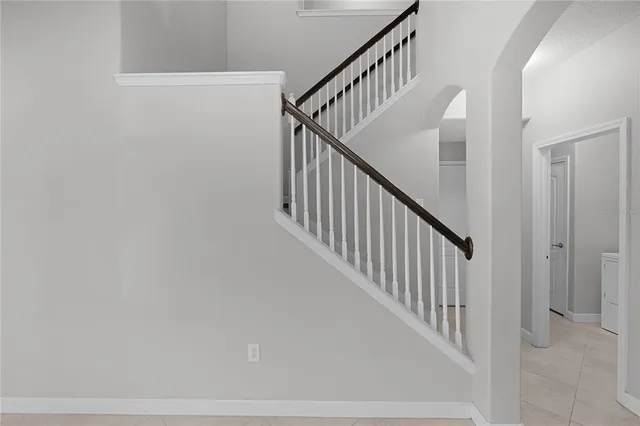 a view of an empty room with glass door
