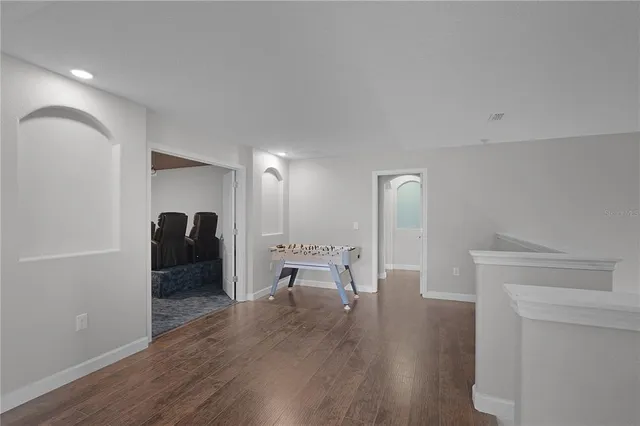 a bathroom with a granite countertop sink a mirror and a shower