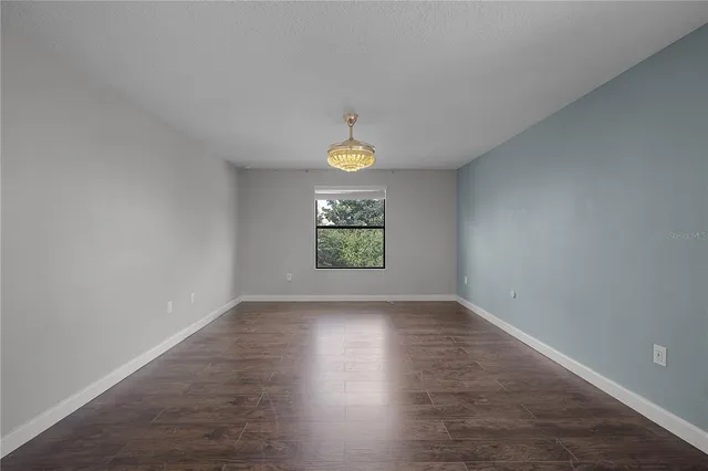 a white toilet sitting next to a bath tub