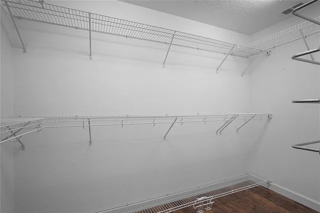 a kitchen with stainless steel appliances granite countertop a sink a counter space and windows