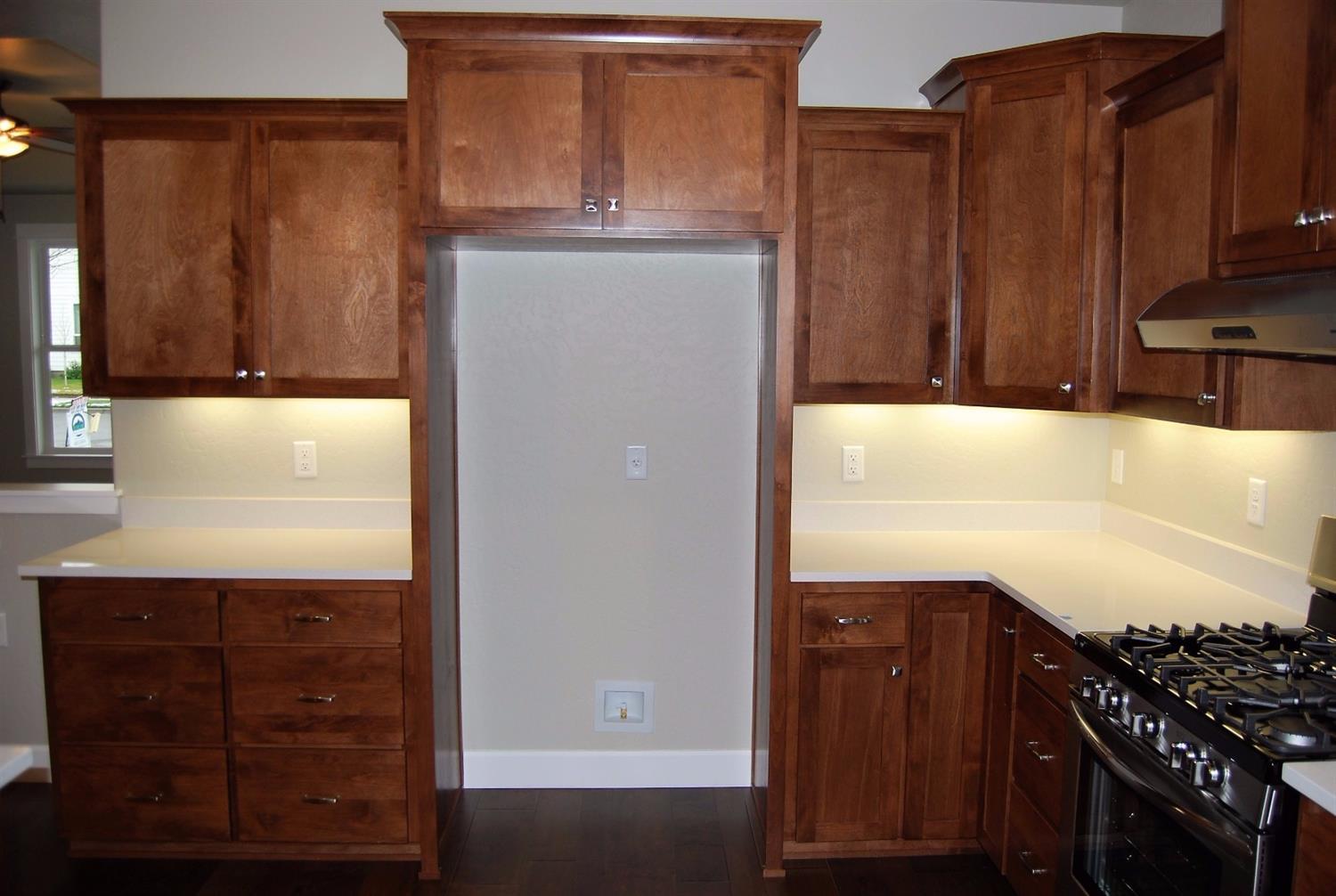 1096 Boulder Ridge Street Central Point, OR 97502 - Photo 9 of 24 Cabinet hardware, gas range, lazy susan.