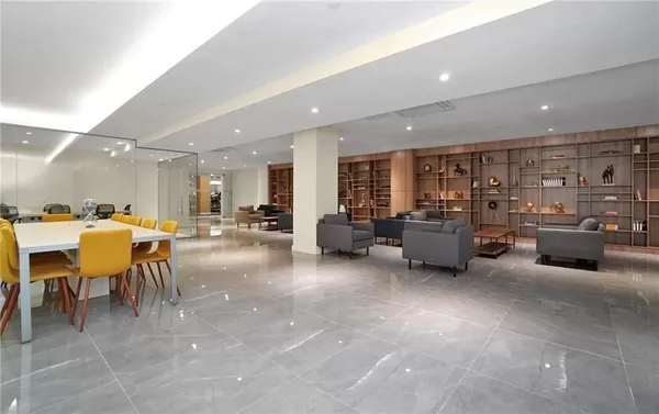 a living room with lots of furniture and a table
