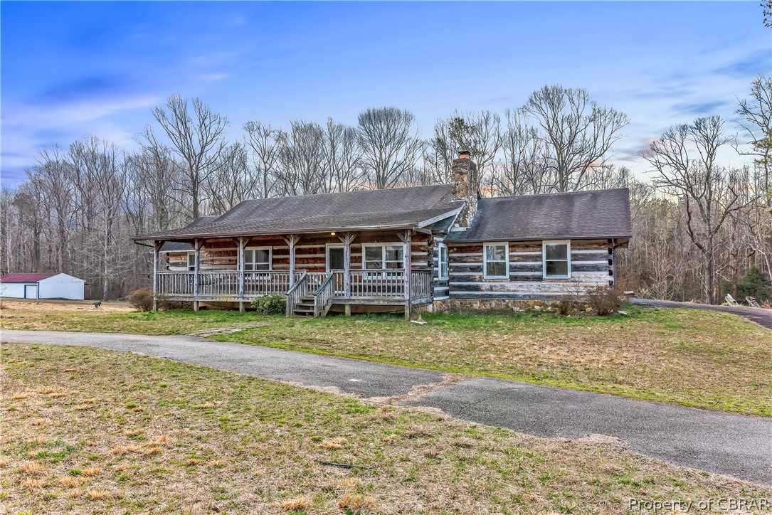 1371 Milby Town Road Shacklefords, VA 23156 - Photo 1 of 27 Front with horseshoe driveway in front of house, and garage access to the right.