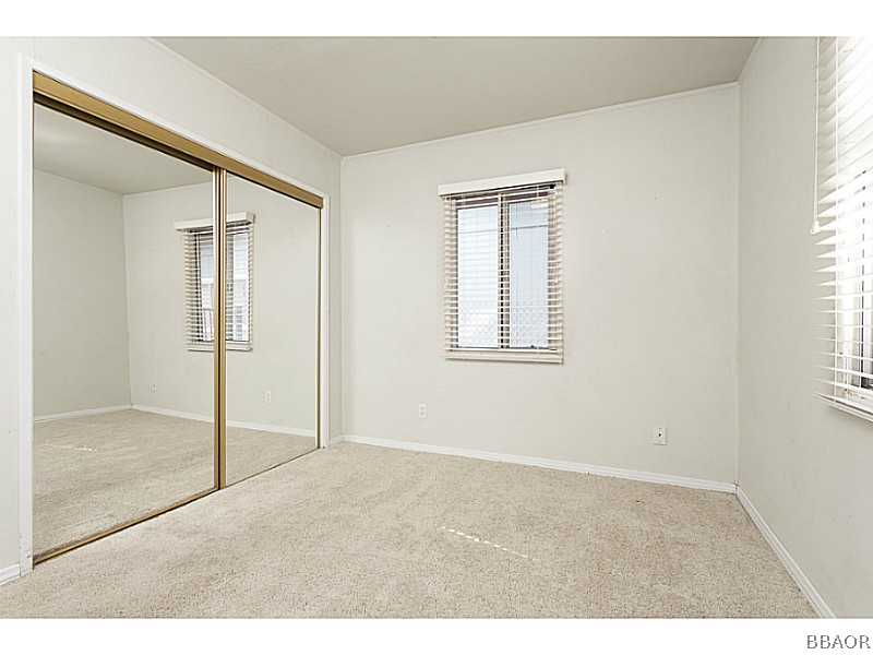 609 Riverside Avenue Sugarloaf, CA 92386 - Photo 19 of 25 a view of an empty room with window