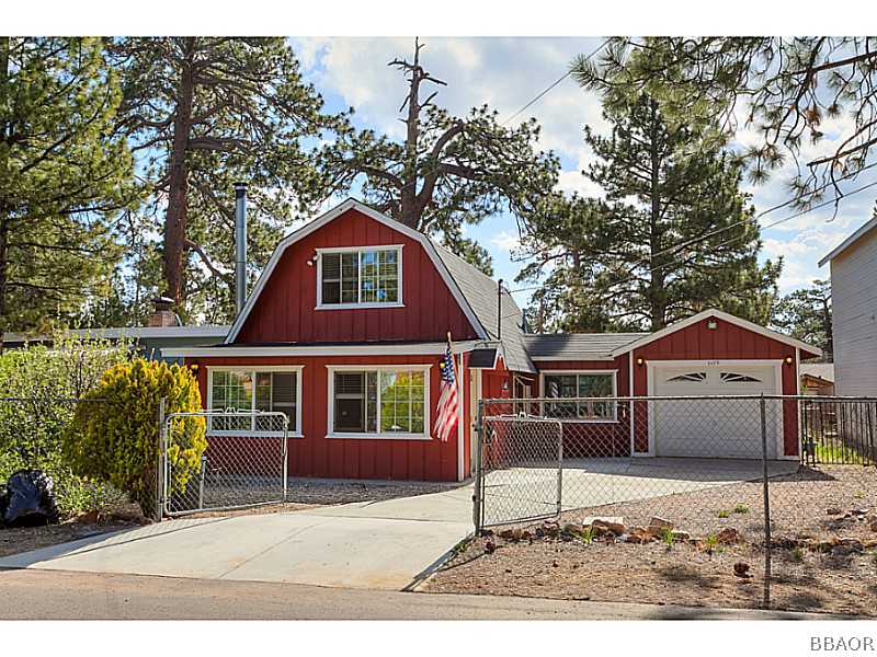 609 Riverside Avenue Sugarloaf, CA 92386 - Photo 2 of 25 a house with trees in the background