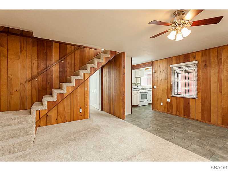 609 Riverside Avenue Sugarloaf, CA 92386 - Photo 7 of 25 a view of an empty room with wooden floor