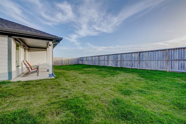 a view of a backyard with a garden