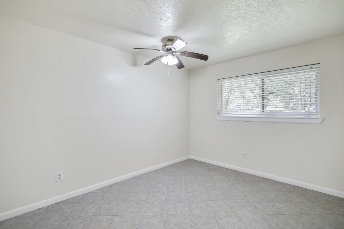 3203 Willie Way Spring, TX 77380 - Photo 14 of 31 an empty room with a window and a fan