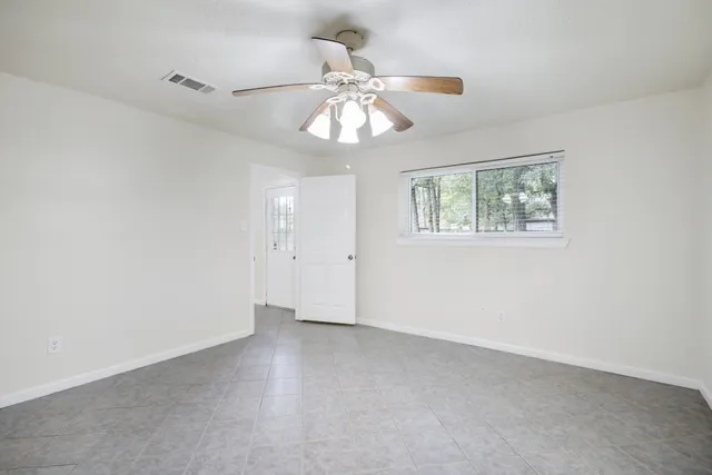 a view of an empty room with a window