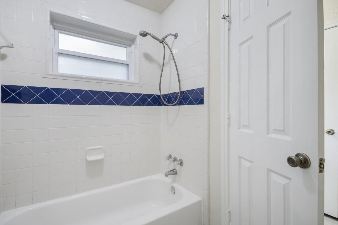 3203 Willie Way Spring, TX 77380 - Photo 25 of 31 a bathroom with a bathtub and a shower