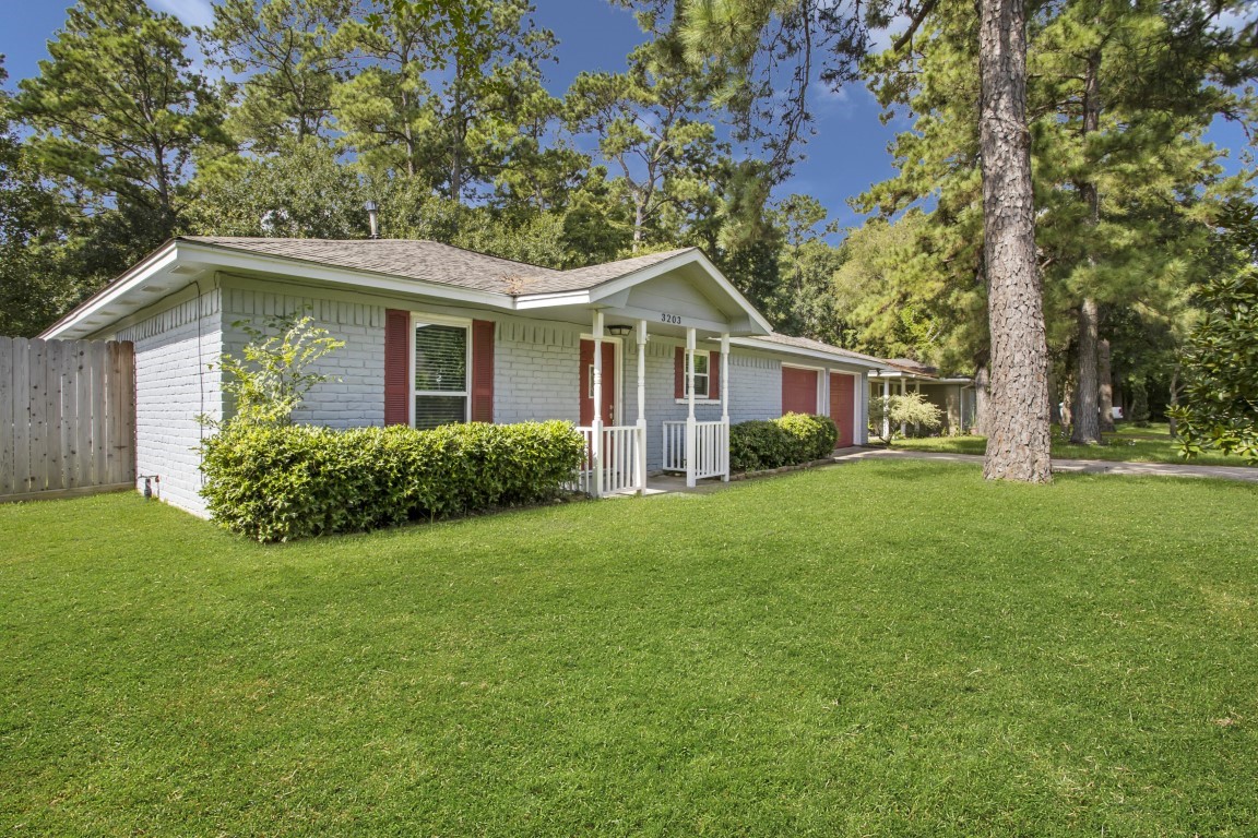 3203 Willie Way Spring, TX 77380 - Photo 31 of 31 a front view of a house with a garden