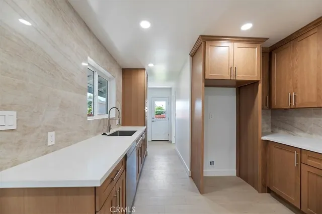 a bathroom with a sink a vanity and a mirror