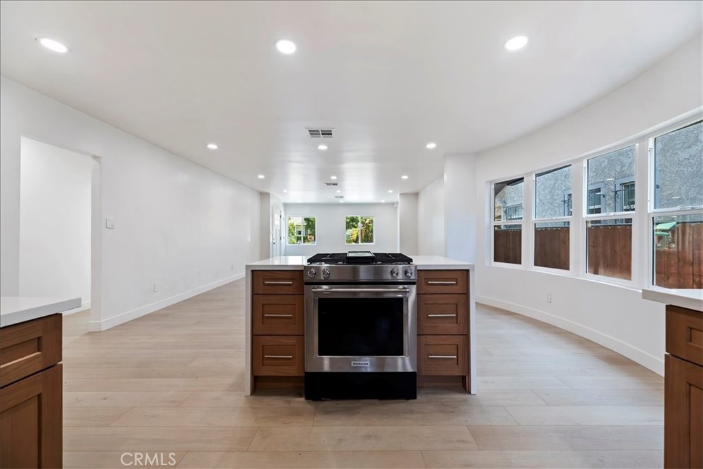 3011 5th Los Angeles, CA 90018 - Photo 22 of 44 a kitchen with stainless steel appliances granite countertop a stove and a refrigerator
