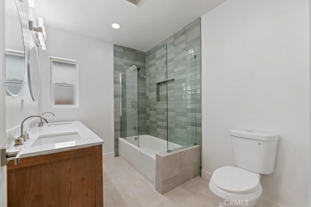 3011 5th Los Angeles, CA 90018 - Photo 26 of 44 a bathroom with a sink toilet and shower