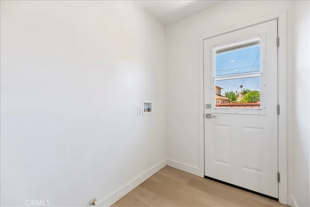 a bedroom with a bed and a mirror