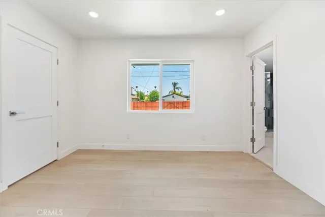 a bathroom with a double vanity sink mirror and toilet